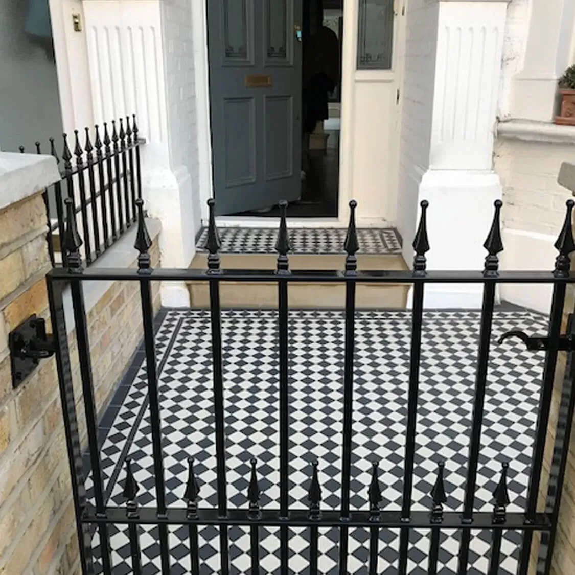 black and white patio on steps