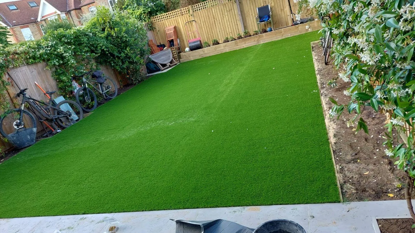 artificial grass with plants around