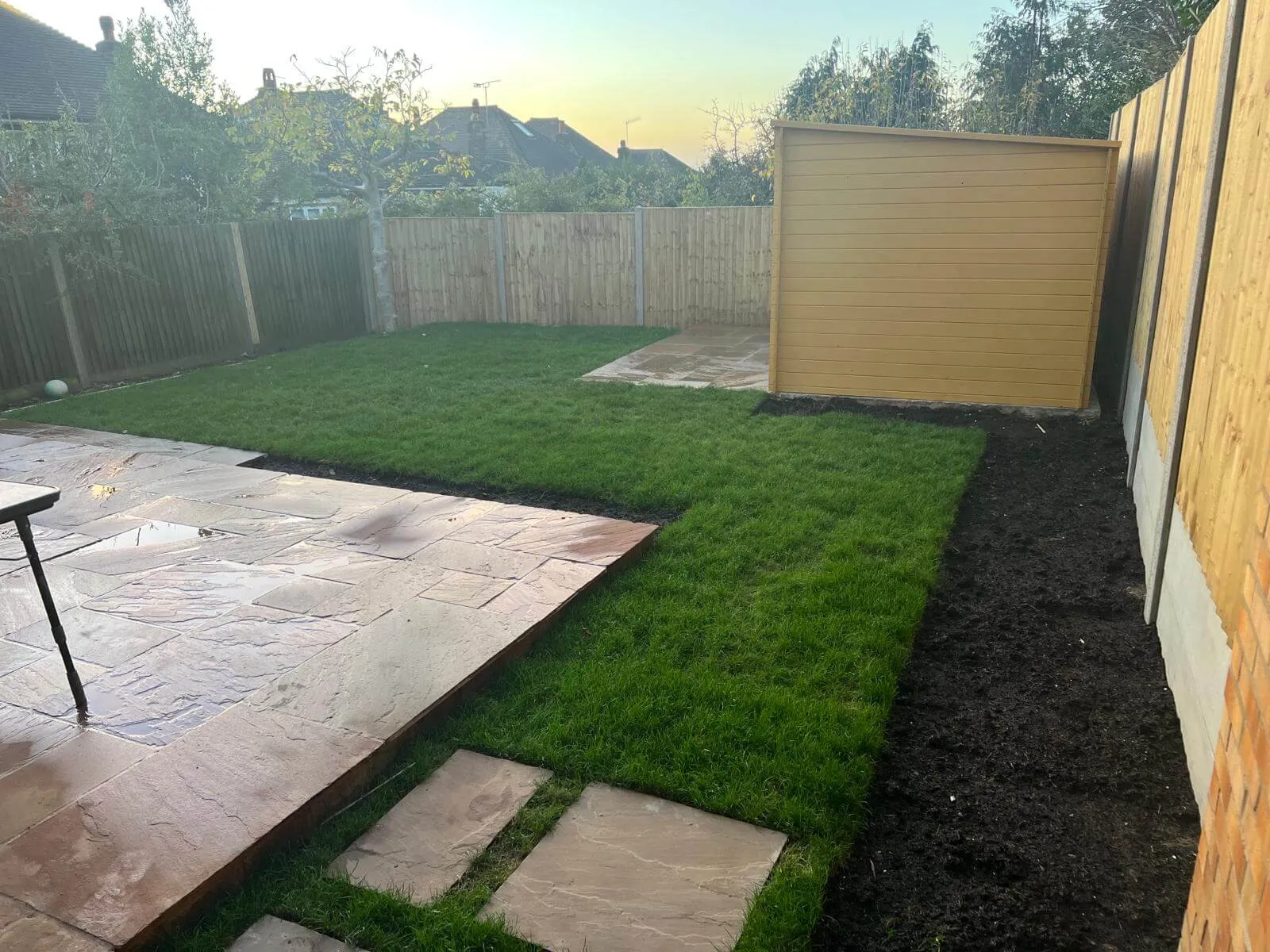 large patio with artifical grass